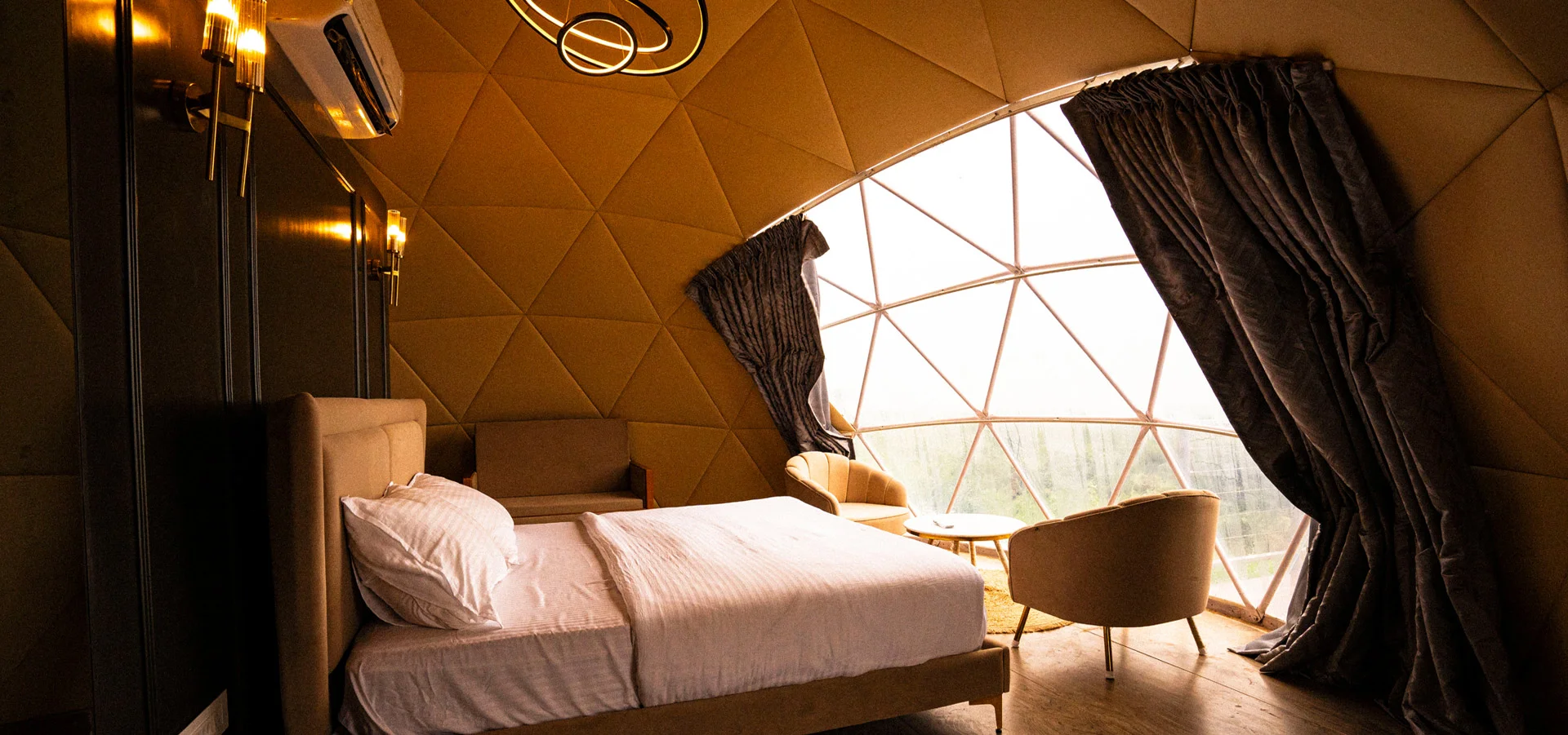 Quilted gold dome interior facing forest window
