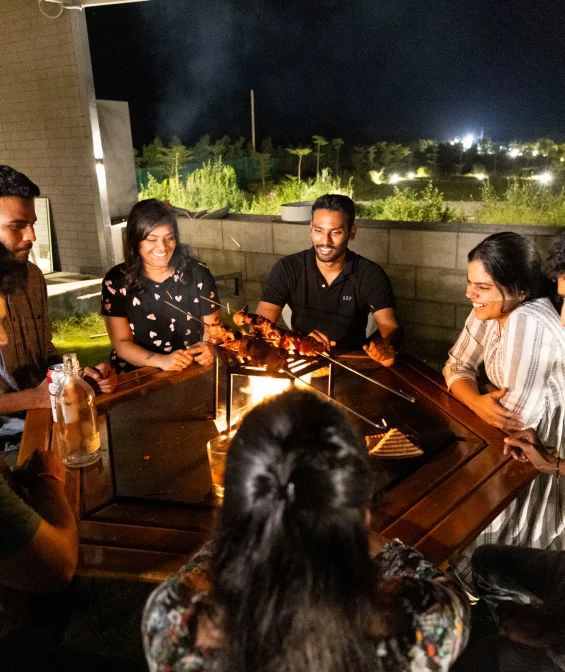 Guests gathered for a hilltop grill dinner