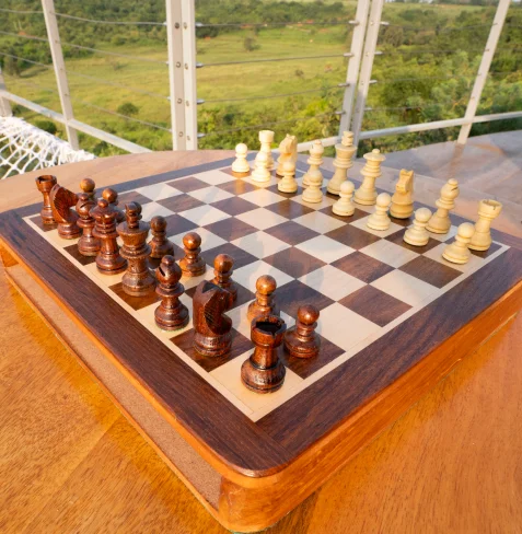 Outdoor chess set on wooden deck