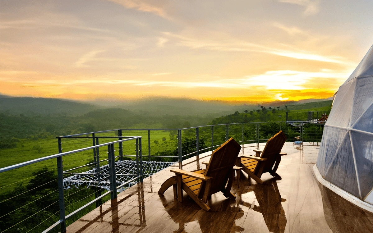 Domes glowing against dramatic evening twilight and hammock deck